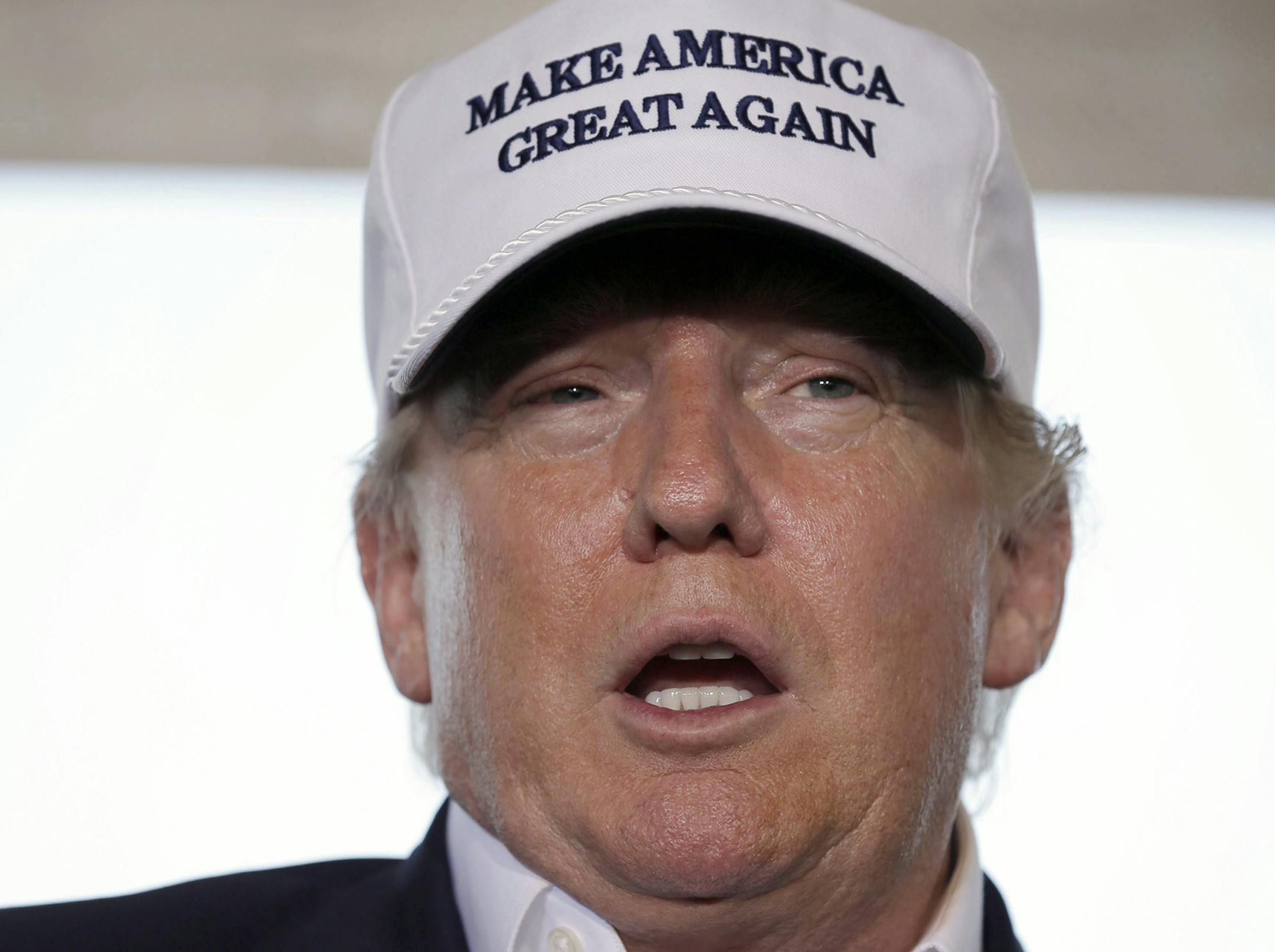 Republican presidential hopeful Donald Trump speaks to the media during a tour of the the World Trade International Bridge at the U.S. Mexico border in Laredo, Texas, Thursday, July 23, 2015. Trump predicted Hispanics would love him, "they already do," because as president he'd grab jobs back from overseas and give more opportunity to those who live in the U.S. legally. (AP Photo/LM Otero) ORG XMIT: TXMO117