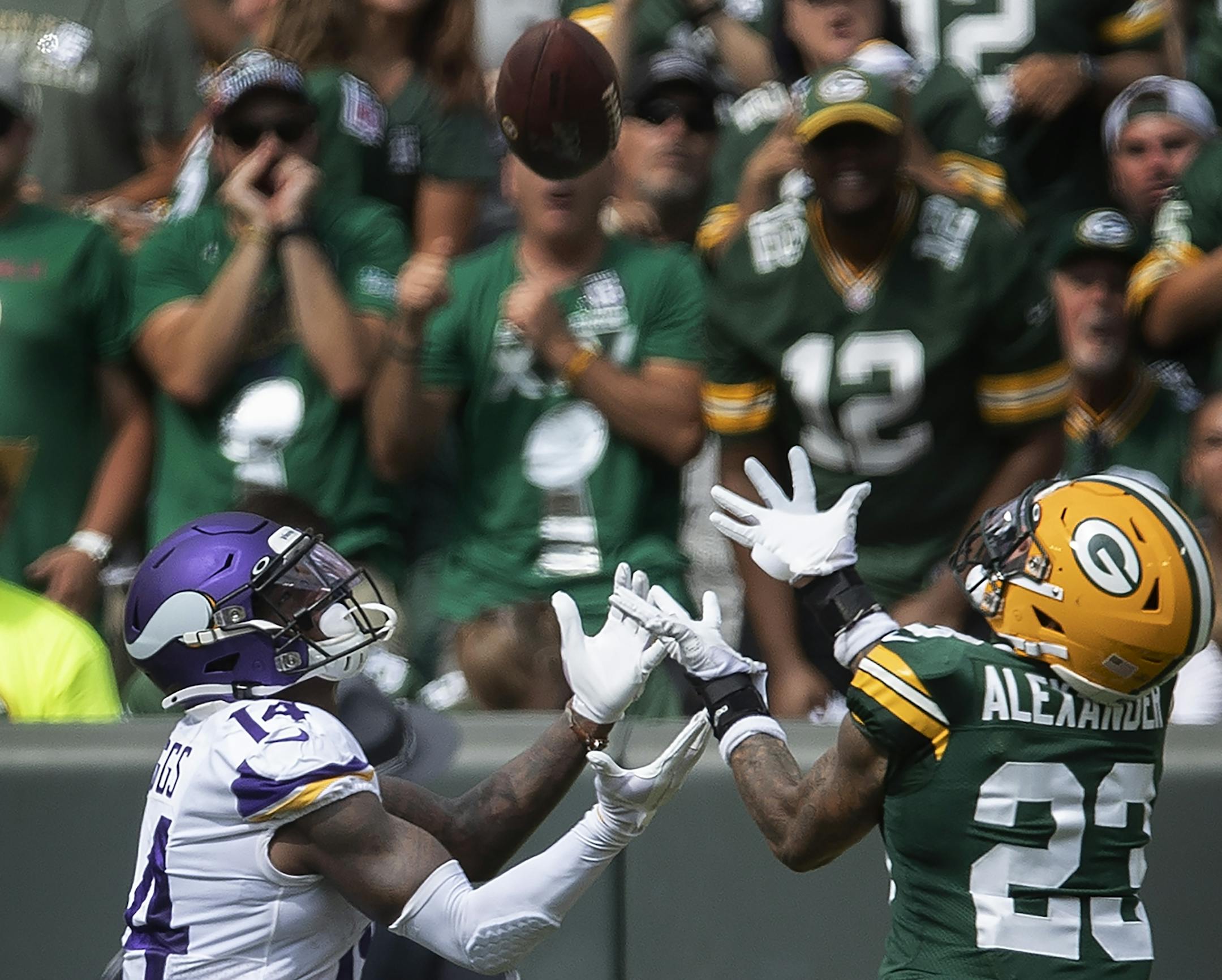 Minnesota Vikings wide receiver Adam Thielen (19) caught a 45 yard touch down catch over Green Bay Packers cornerback Jaire Alexander (23) in the third quarter at Lambeau Field.