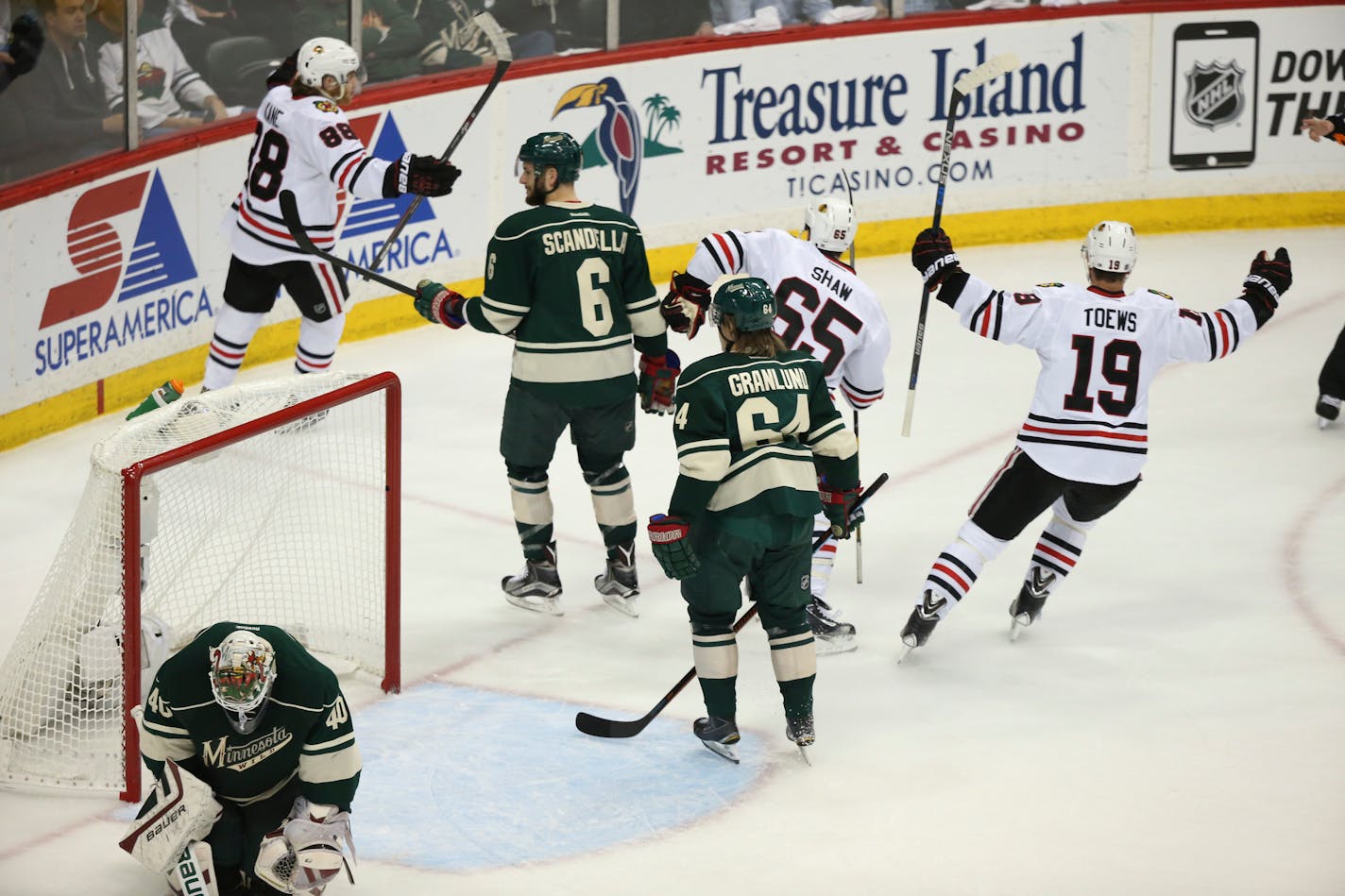 Blackhawks right wing Patrick Kane (88) celebrated after he scored on Wild goalie Devan Dubnyk in the first period Tuesday night.