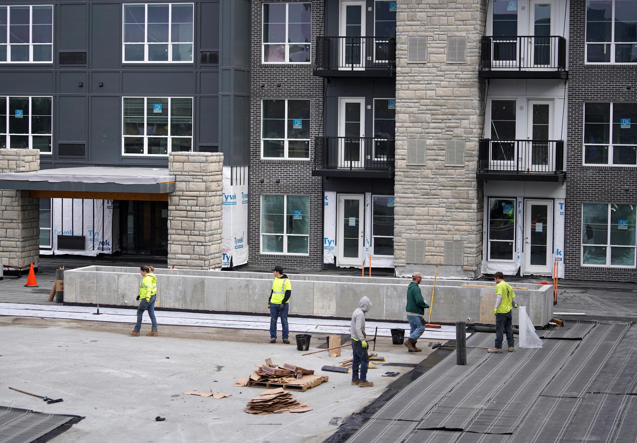 Workers at the Maven apartment construction site in Burnsville Tuesday morning.