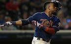 Minnesota Twins shortstop Jorge Polanco (11) lost his helmet as he swung at the ball in the bottom of the ninth inning Saturday night. ] Aaron Lavinsk