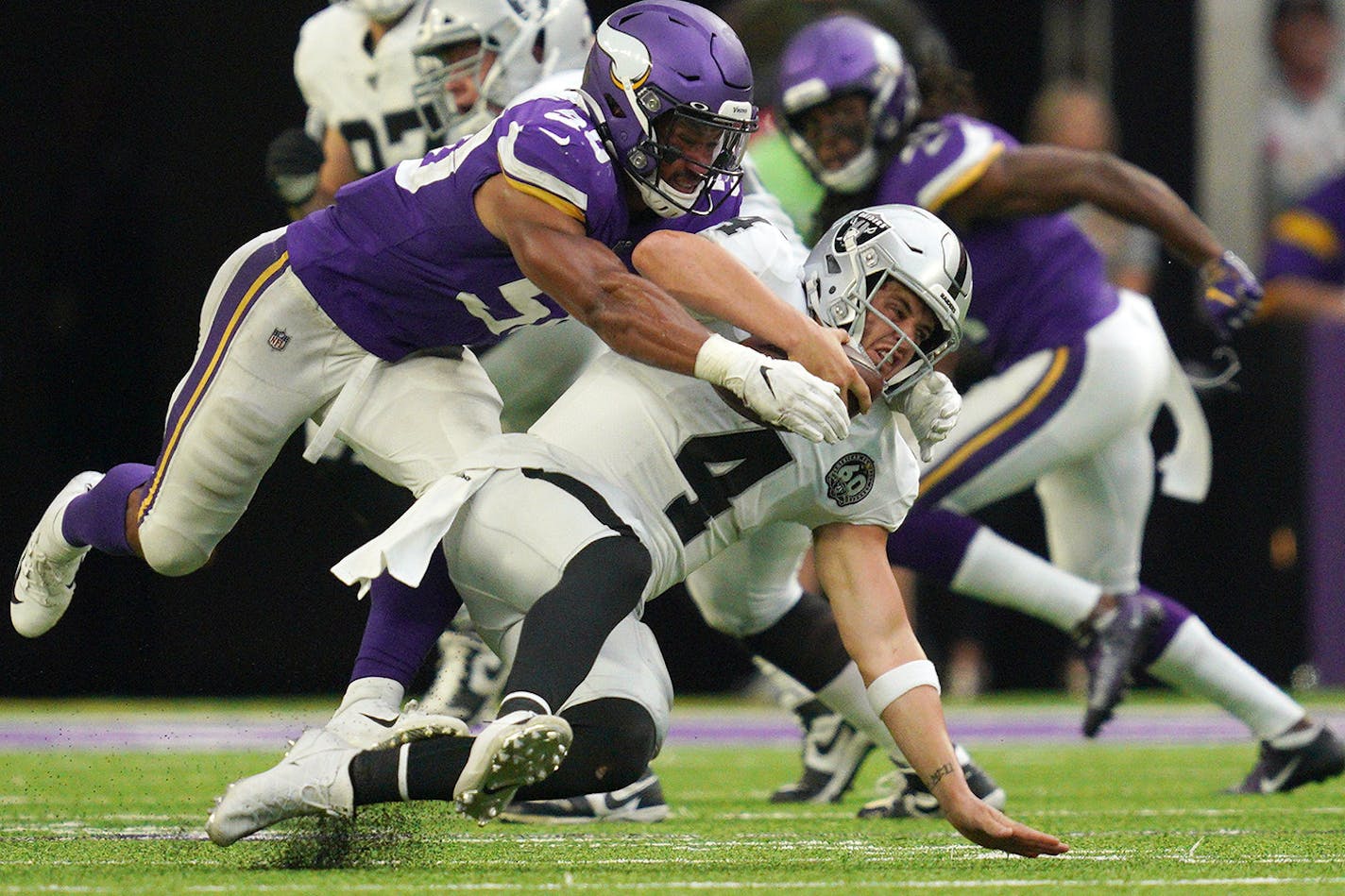 Minnesota Vikings linebacker Eric Wilson (50) sacked Oakland Raiders quarterback Derek Carr (4) in the fourth quarter.