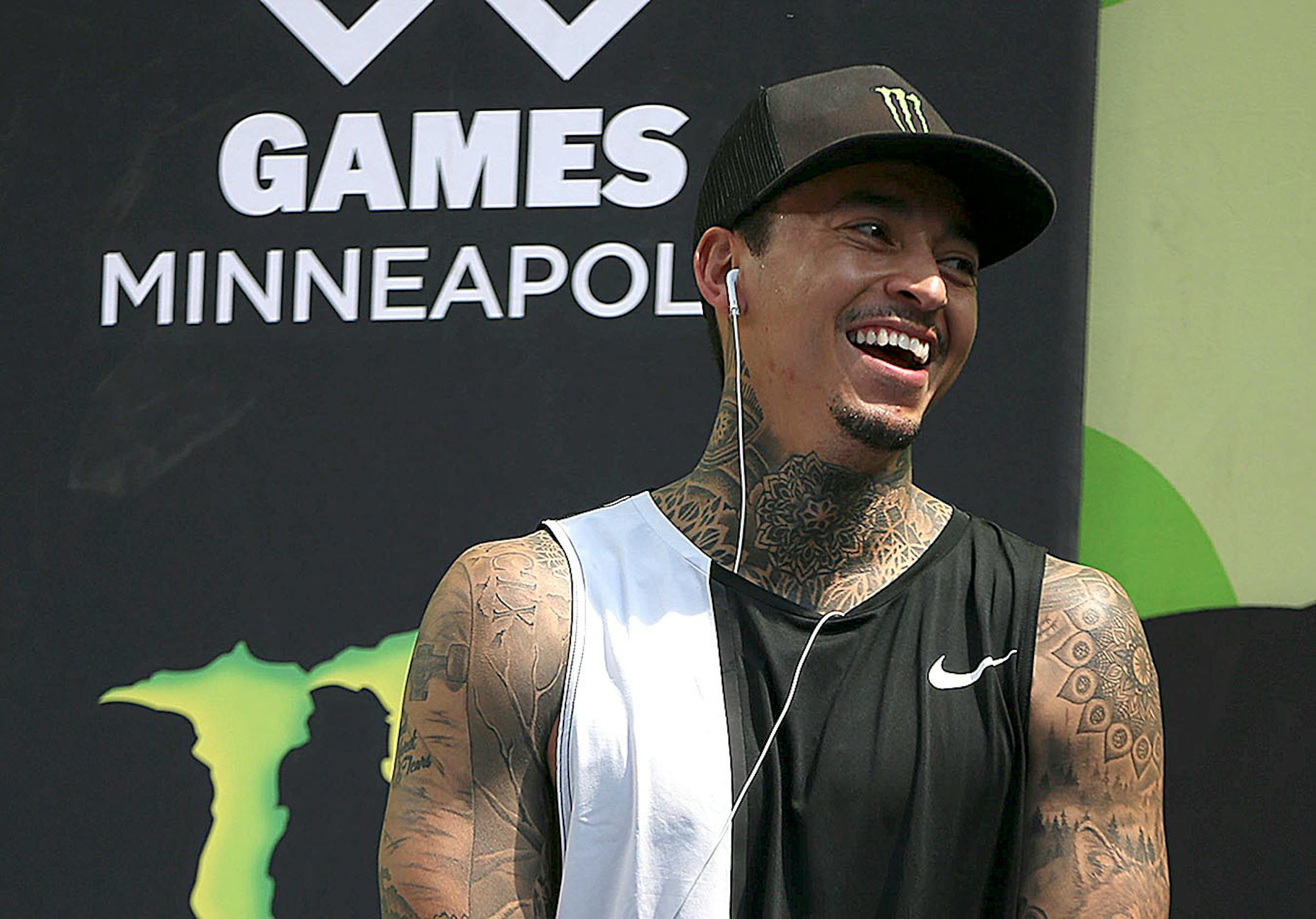 Nyjah Huston, the eventual gold medal winner, laughs in the final moments of the men's skateboard street final.