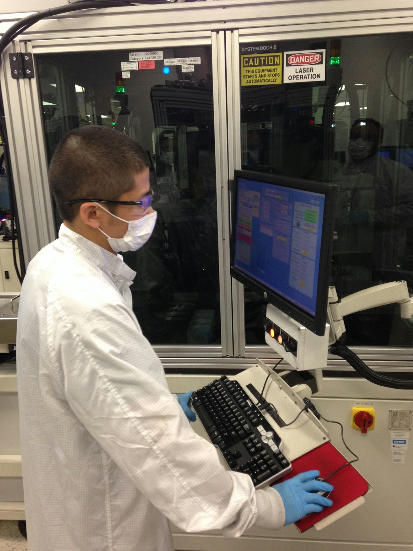 Boston Scientific&#xed;s robotic assembly line for defibrillator batteries in Arden Hill. Pictured is a Boston Scientific worker operating one of the stations in the robotic assembly process in September 2016.