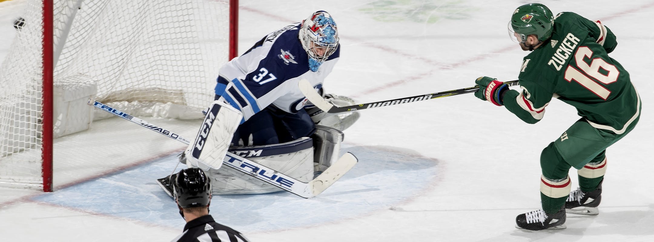 Jason Zucker (16) shot the puck past Jets goalie Connor Hellebuyck (37) for his second goal in the second period.