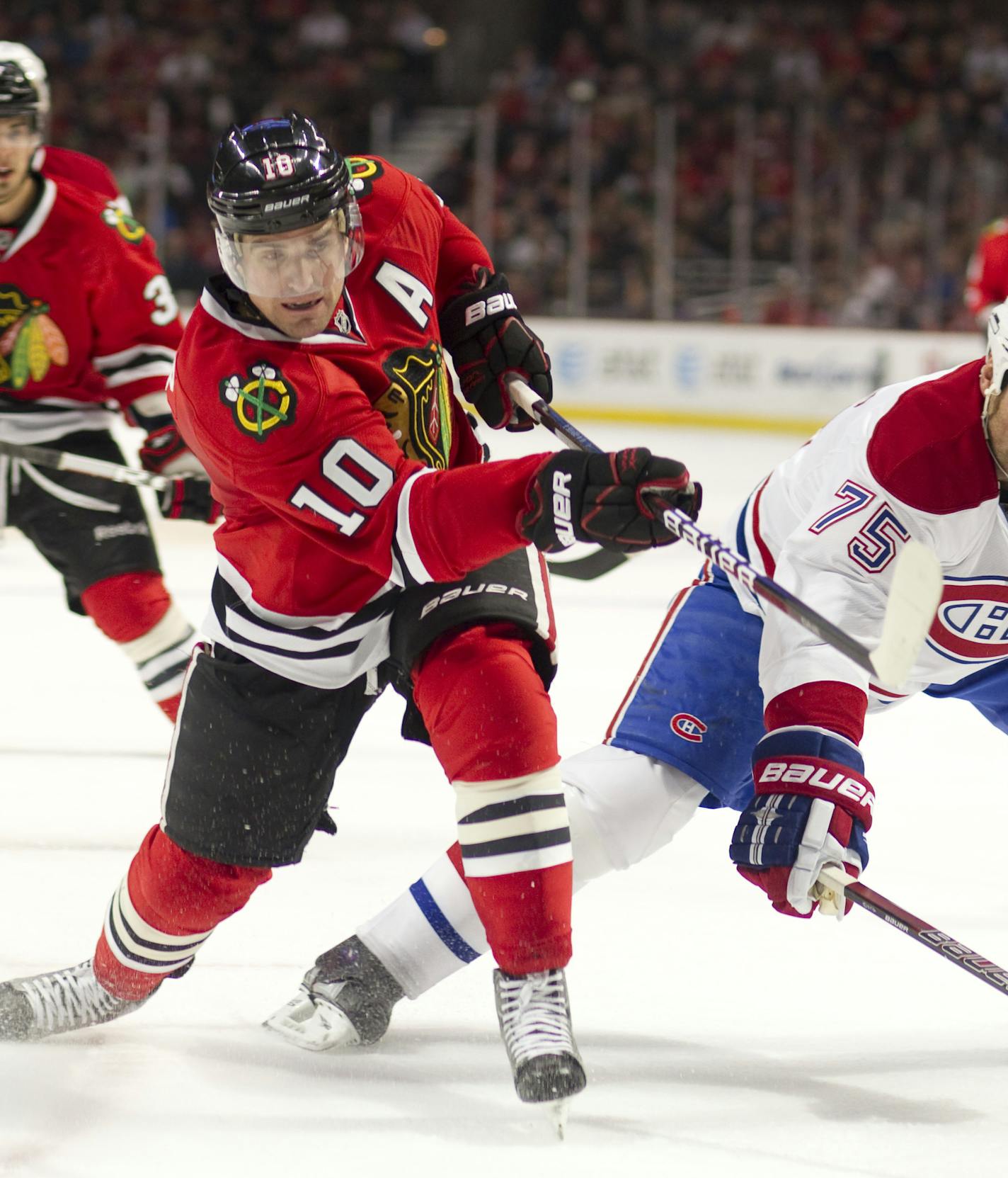 December 21, 2011: Chicago, IL. Blackhawk Patrick Sharp #10 and Canadien Hal Gill #75 in action during the NHL game between the Chicago Blackhawks and the Montreal Canadiens at the United Center in Chicago, IL. (Cal Sport Media via AP Images) ORG XMIT: CSMAP