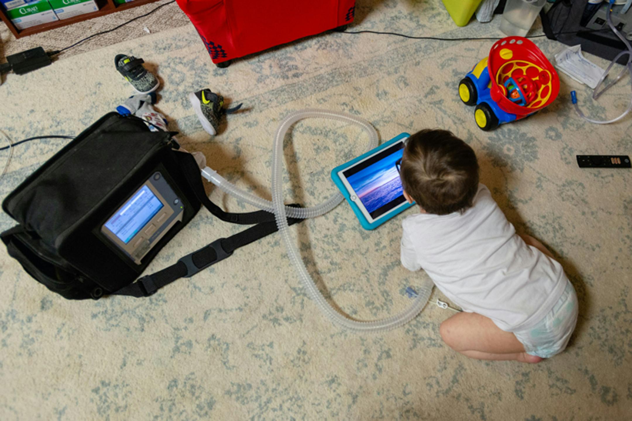 Anderson Moreno uses a portable ventilator because of his impaired lung capacity. (Heidi de Marco/KHN/TNS)