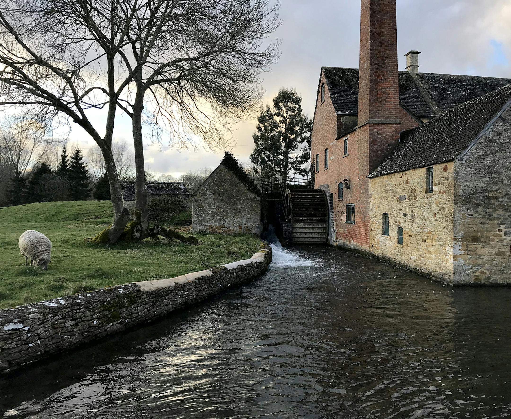. It is a great photo from a great day of driving through the Cotswolds area of England. This photo is taken in village of Lower Slaughter, in the Cotswolds. We rented a car from London and took many deep breaths as I learned to drive on the opposite side of the road. I wanted to see Stonehenge and my wife planned the rest of the journey through the Cotswolds. We stopped in Bourton on the Water that has a model village of the city that is 1/9 the size of the buildings. Next, we drove north to St