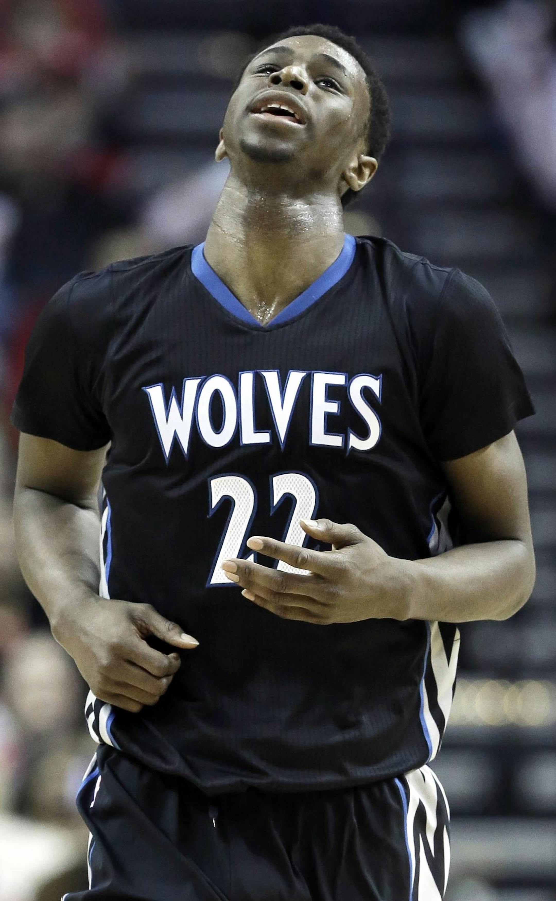 Minnesota Timberwolves' Andrew Wiggins heads back up court after missing a shot against the Houston Rockets in the second half of an NBA basketball game Monday, Feb. 23, 2015, in Houston. The Rockets won 113-102. (AP Photo/Pat Sullivan)