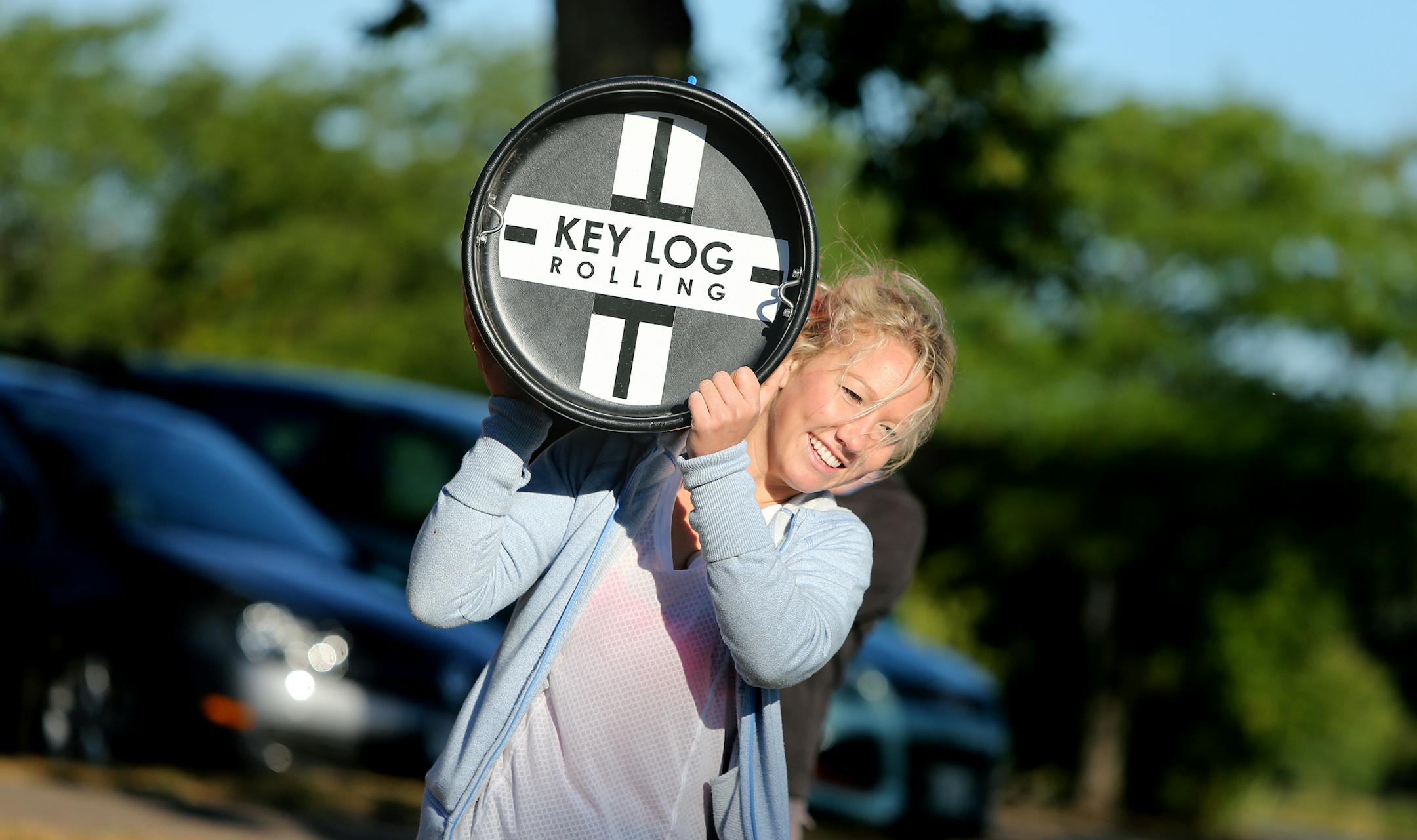 Abby Hoeschler, a log rolling instructor, carried her log rolling beam to practice the sport on Lake Calhoun, Thursday, September 12, 2013 in Minneapolis, MN.(ELIZABETH FLORES/STAR TRIBUNE) ELIZABETH FLORES • eflores@startribune.com