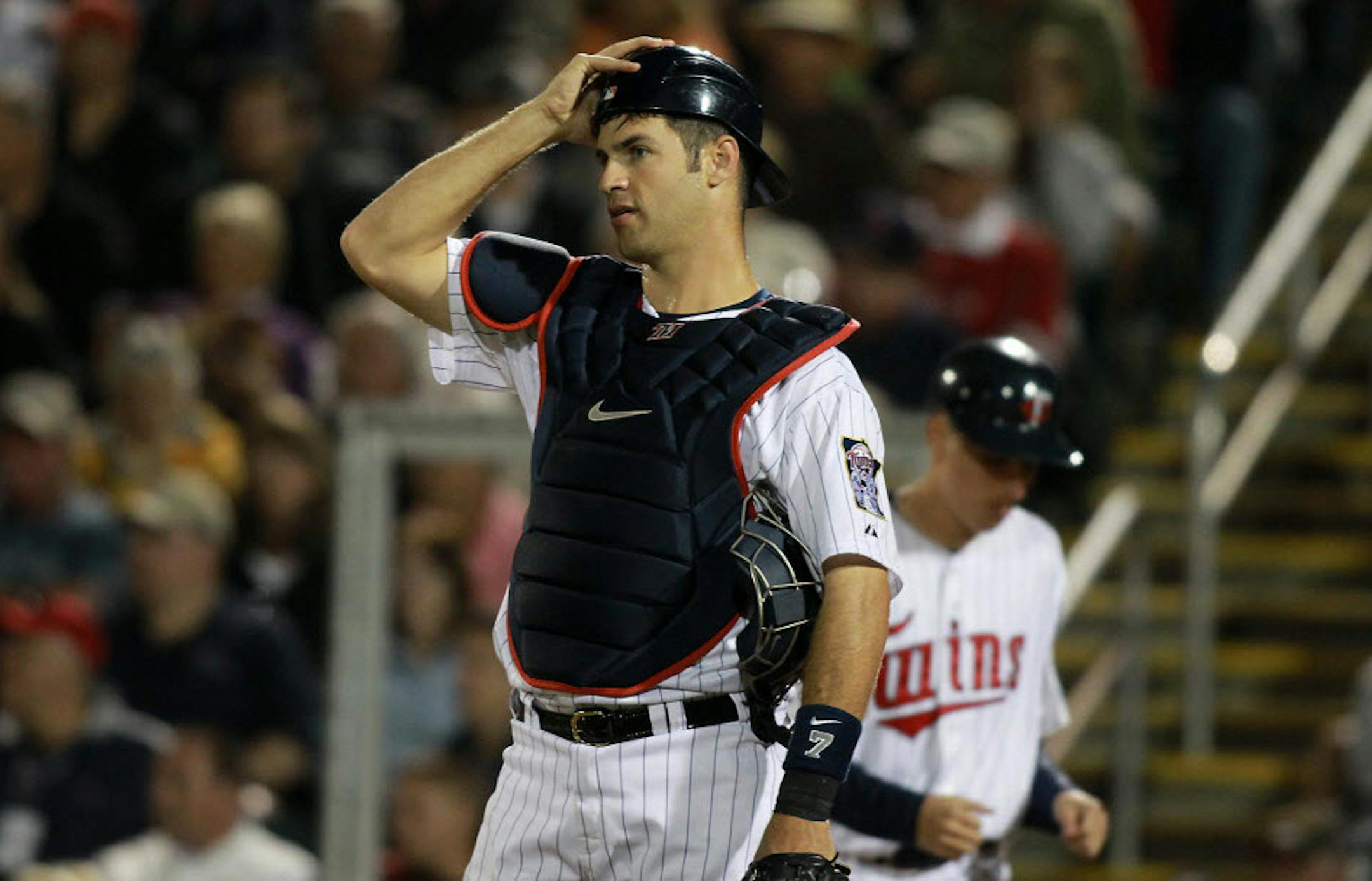 Catching every day isn't the only option for Joe Mauer: He expects to play some at first base and designated hitter for the Twins.