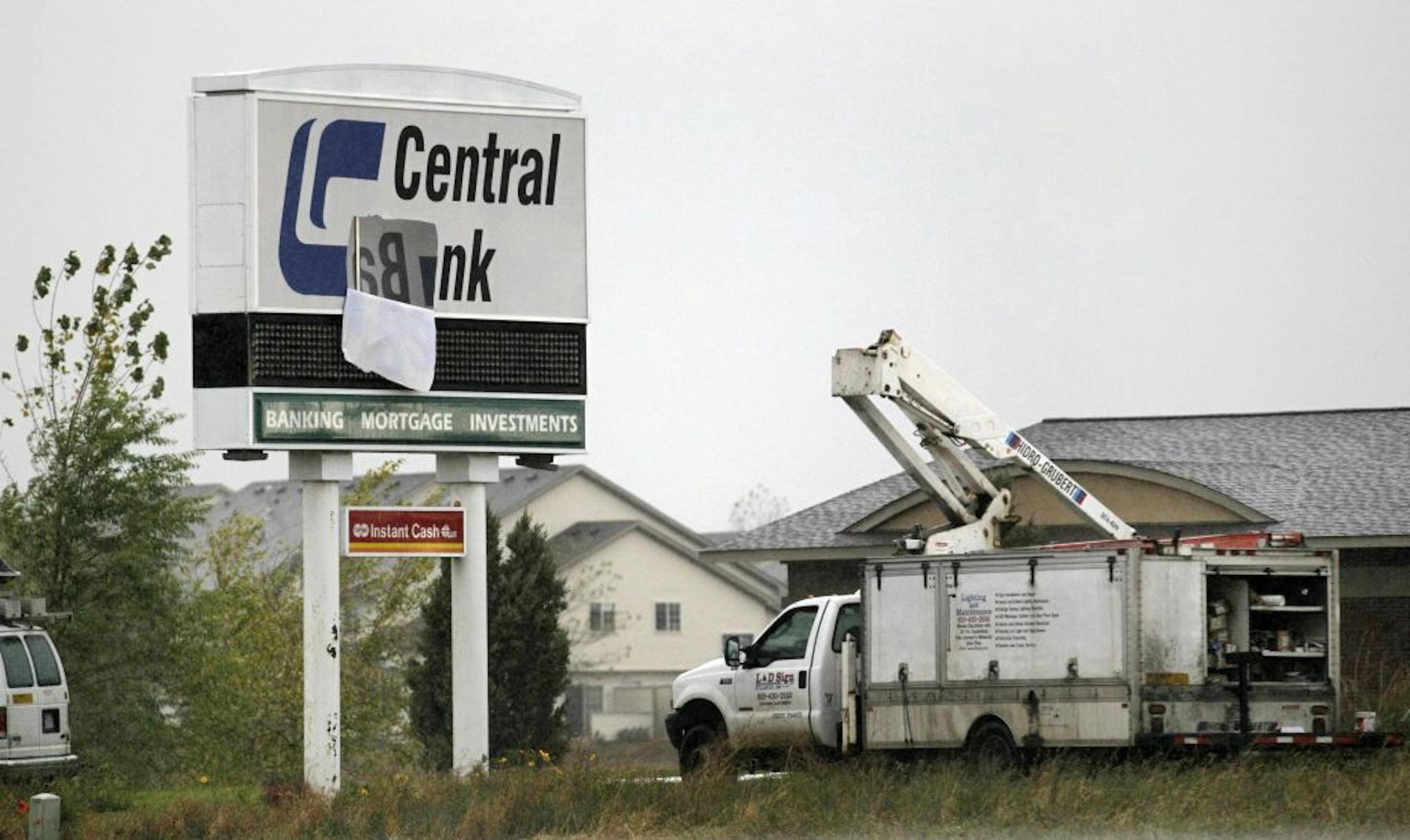 The 48-year-old man was electrocuted about 11:30 a.m. Wednesday outside Central Bank in Centerville while trying to repair a sign. BRIAN PETERSON • brianp@startribnune.com Centerville, MN - 10/12/2011