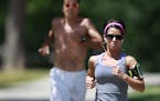 Joggers run laps around Washington Park, in Denver, Colorado, Monday July 8, 2013. Colorado is ranked as one of the healthiest states in America, but 