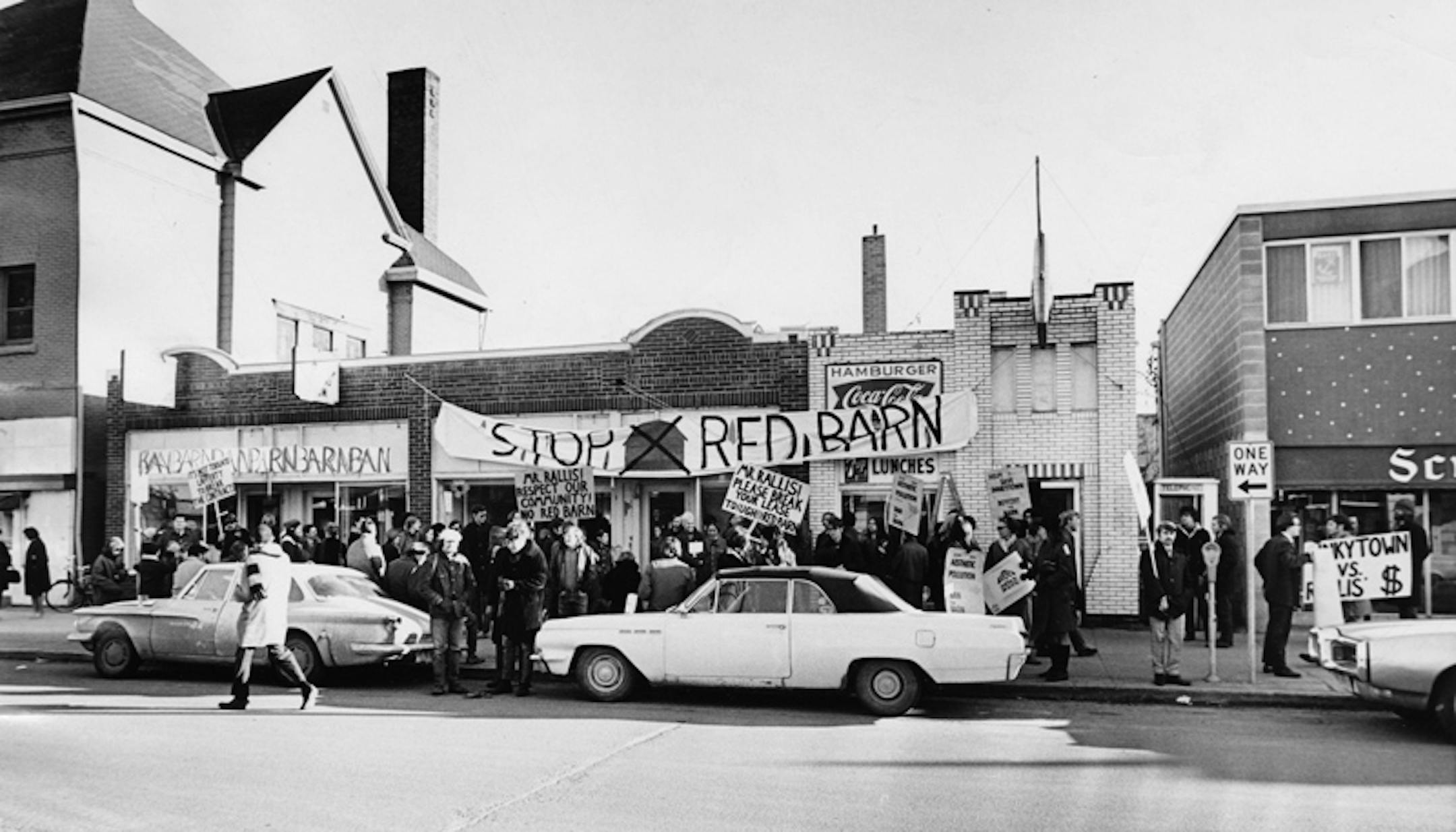 Group protesting demolition of Dinkytown stores picket the site. (April, 1970)