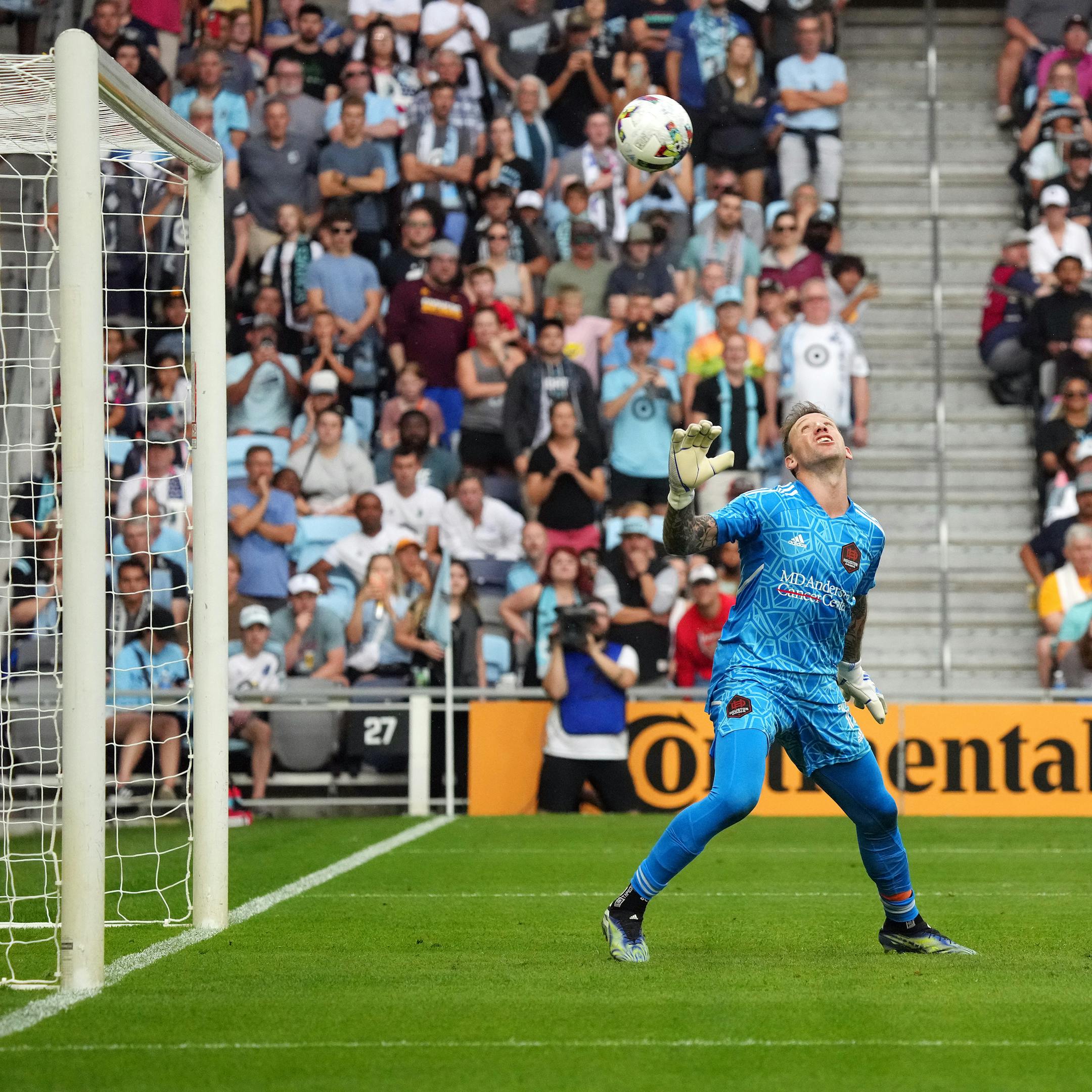 Houston Dynamo goalkeeper Steve Clark (12) watches as a free kick by Minnesota United midfielder Emanuel Reynoso (10) sails over his head and was deflected by a Houston player for a second-half own-goal during an MLS game between Minnesota United and the Houston Dynamo.