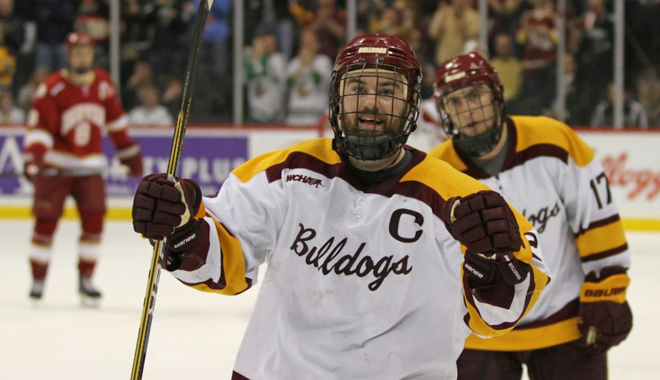 WCHA Frozen Five Semi-Finals, University of Minnesota Duluth vs. Denver, Xcel Center, 3/16/12. (center) UMD's Jack Connolly celebrated his third period goal that tied the game with Denver.