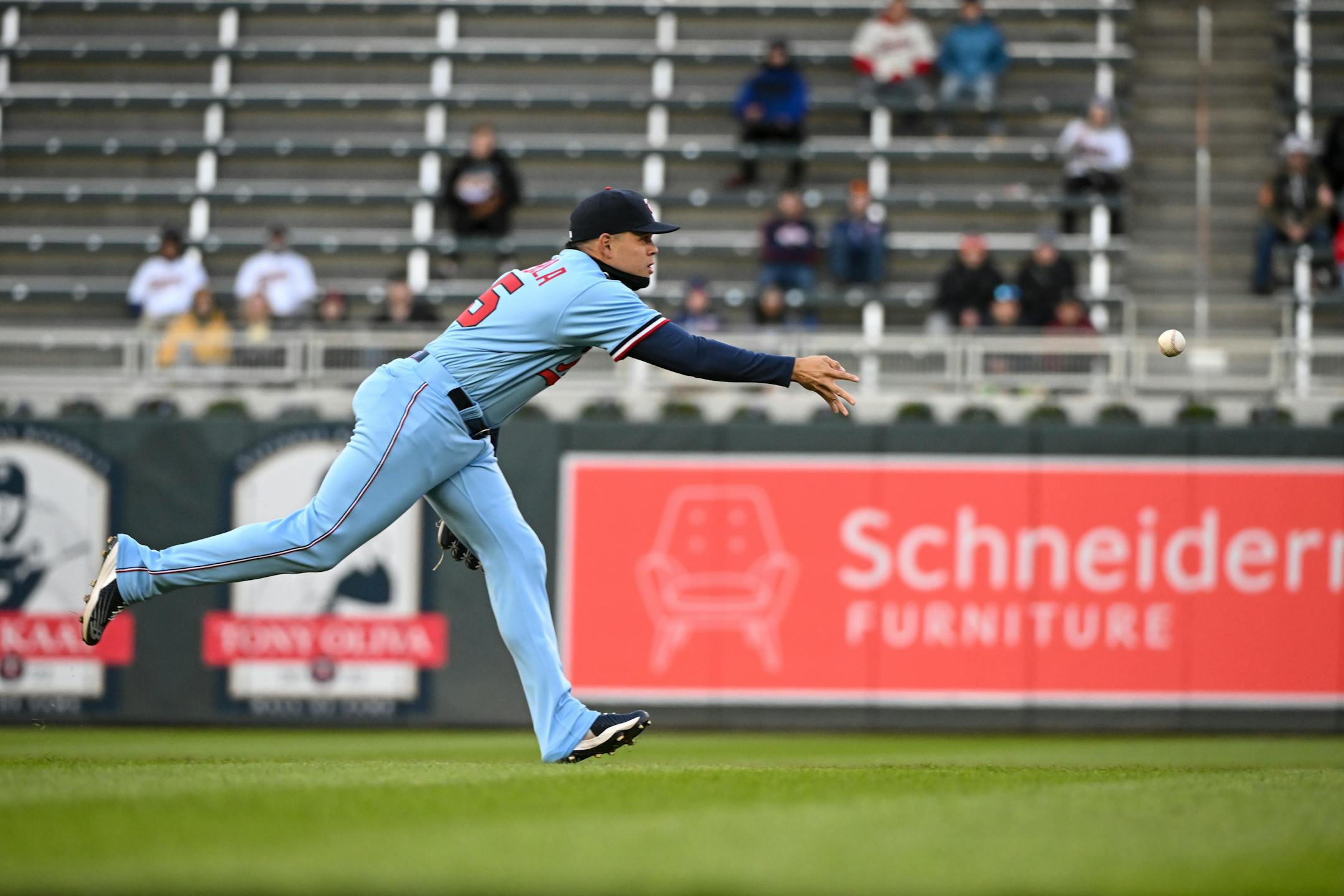 After fielding a ground ball hit by Detroit Tigers third baseman Jeimer Candelario (46), Minnesota Twins third baseman Gio Urshela (15) throws first baseman Spencer Torkelson (20) out at second to start a double play sequence.