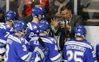 Air Force head coach Frank Serratore talks with his team during a time out during the first period of an NCAA regional men's college hockey tournament