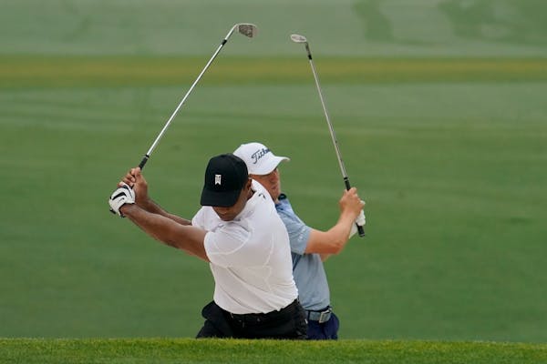 Tiger Woods, front, and Justin Thomas played a practice round together Wednesday ahead of the Masters. 