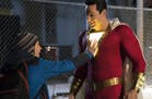 This image released by Warner Bros. shows Zachary Levi, right, and Jack Dylan Grazer in a scene from "Shazam!" (Steve Wilkie/Warner Bros. Entertainmen