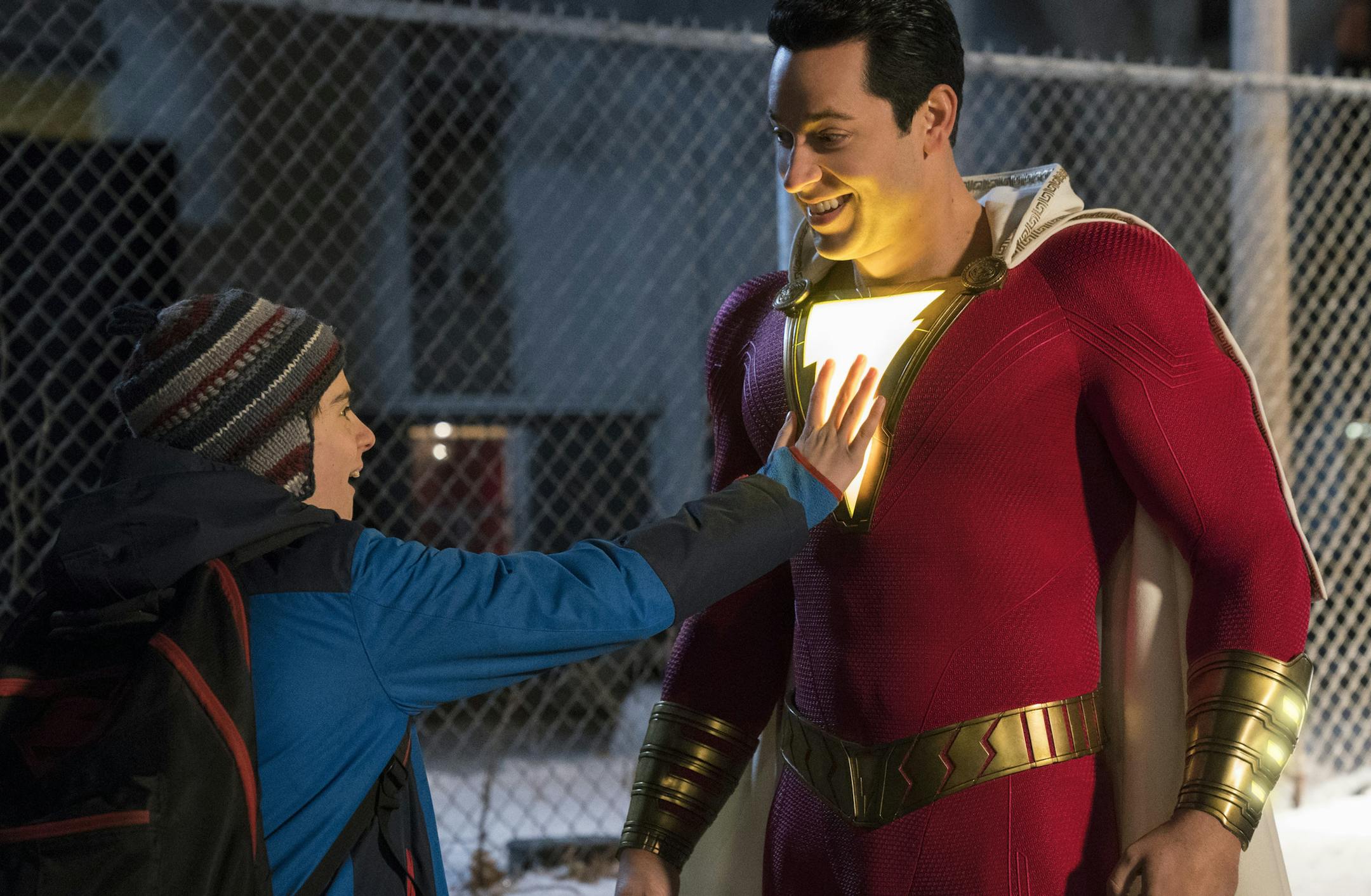 This image released by Warner Bros. shows Zachary Levi, right, and Jack Dylan Grazer in a scene from "Shazam!" (Steve Wilkie/Warner Bros. Entertainment via AP)
