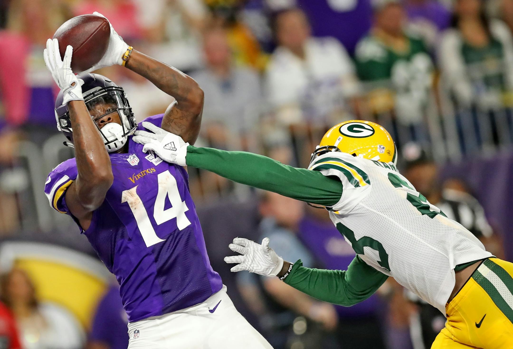Vikings Stefon Diggs catches a TD pass from Sam Bradford in the 3rd quarter. The Minnesota Vikings open the new US Bank Stadium for their first home regular season game against the Green Bay Packers. Here,