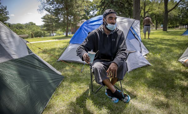 Dennis Barrow drank his coffee just outside his small tent at Powderhorn Park, Friday, June 12, 2020 in Minneapolis, MN. He and a small crowd of homel