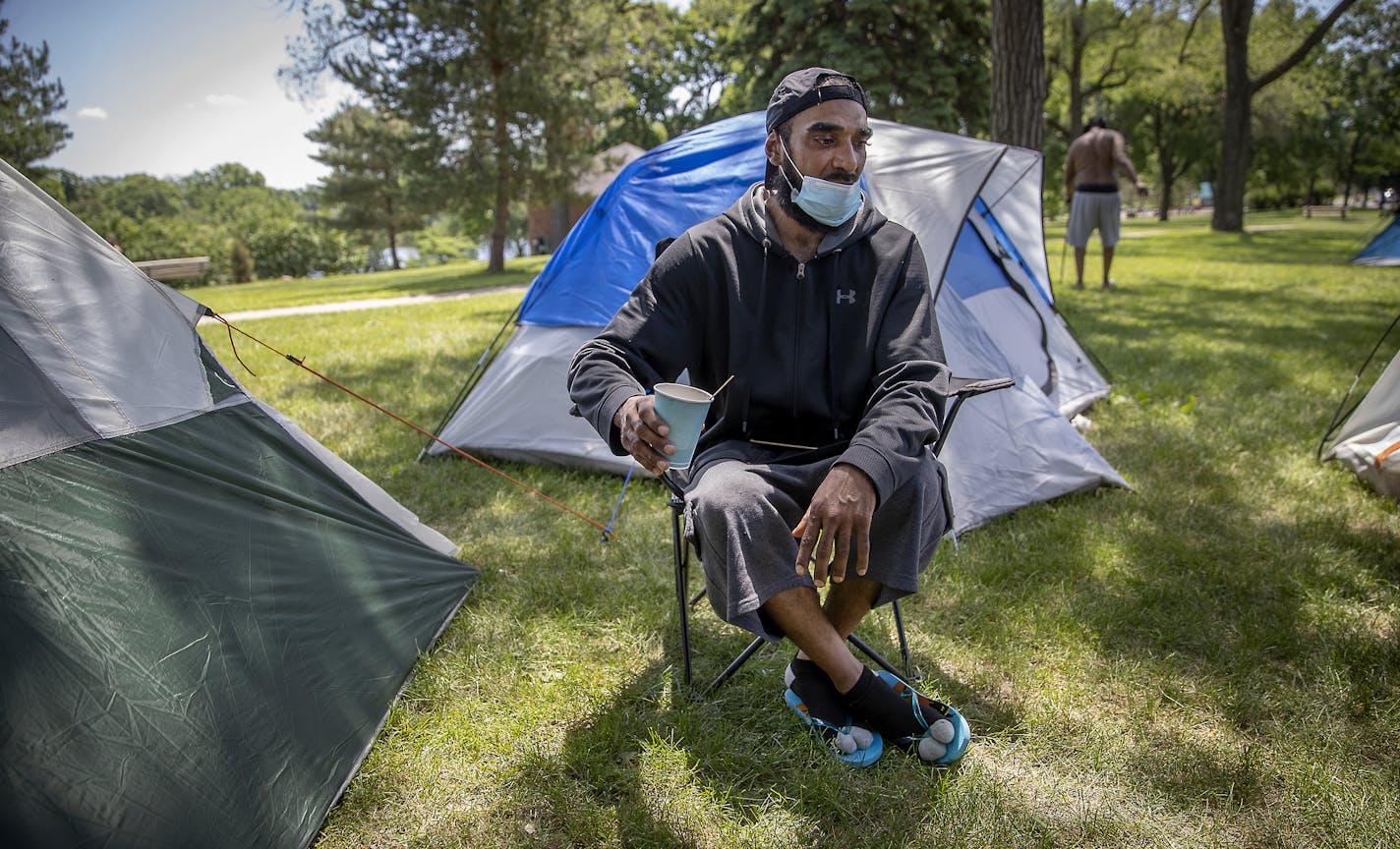 Dennis Barrow drank his coffee just outside his small tent at Powderhorn Park, Friday, June 12, 2020 in Minneapolis, MN. He and a small crowd of homeless people migrated to Powderhorn Park and pitched tents following the abrupt closure of the former Sheraton Hotel, which had become a sanctuary for the homeless amid the street protests last week. ] ELIZABETH FLORES • liz.flores@startribune.com