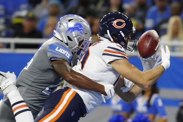 Chicago Bears tight end Jesper Horsted, defended by Detroit Lions defensive back Will Harris, catches an 18-yard pass for a touchdown