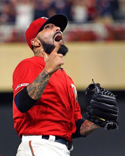 Twins pitcher Sergio Romo celebrated the final out, giving the Twins a 11-9 victory over the Royals.