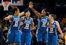 Members of the Minnesota Lynx, from left, Maya Moore, Seimone Augustus, Rebekkah Brunson and Lindsay Whalen celebrate during the second half in Game 4