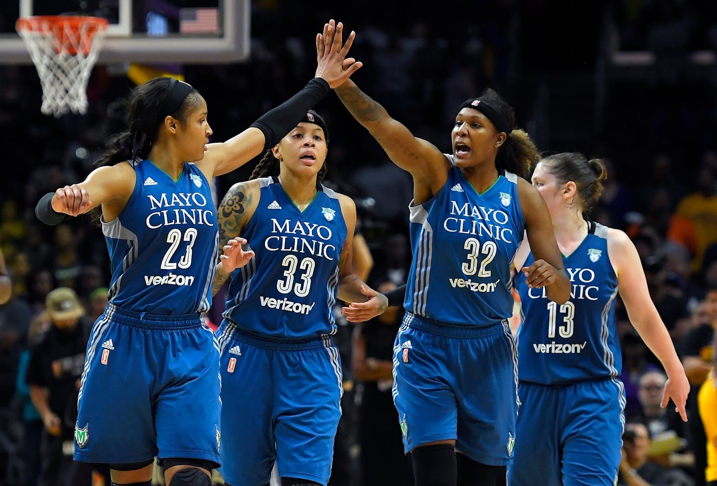 Members of the Minnesota Lynx, from left, Maya Moore, Seimone Augustus, Rebekkah Brunson and Lindsay Whalen celebrate during the second half in Game 4 of the WNBA Finals against the Los Angeles Sparks