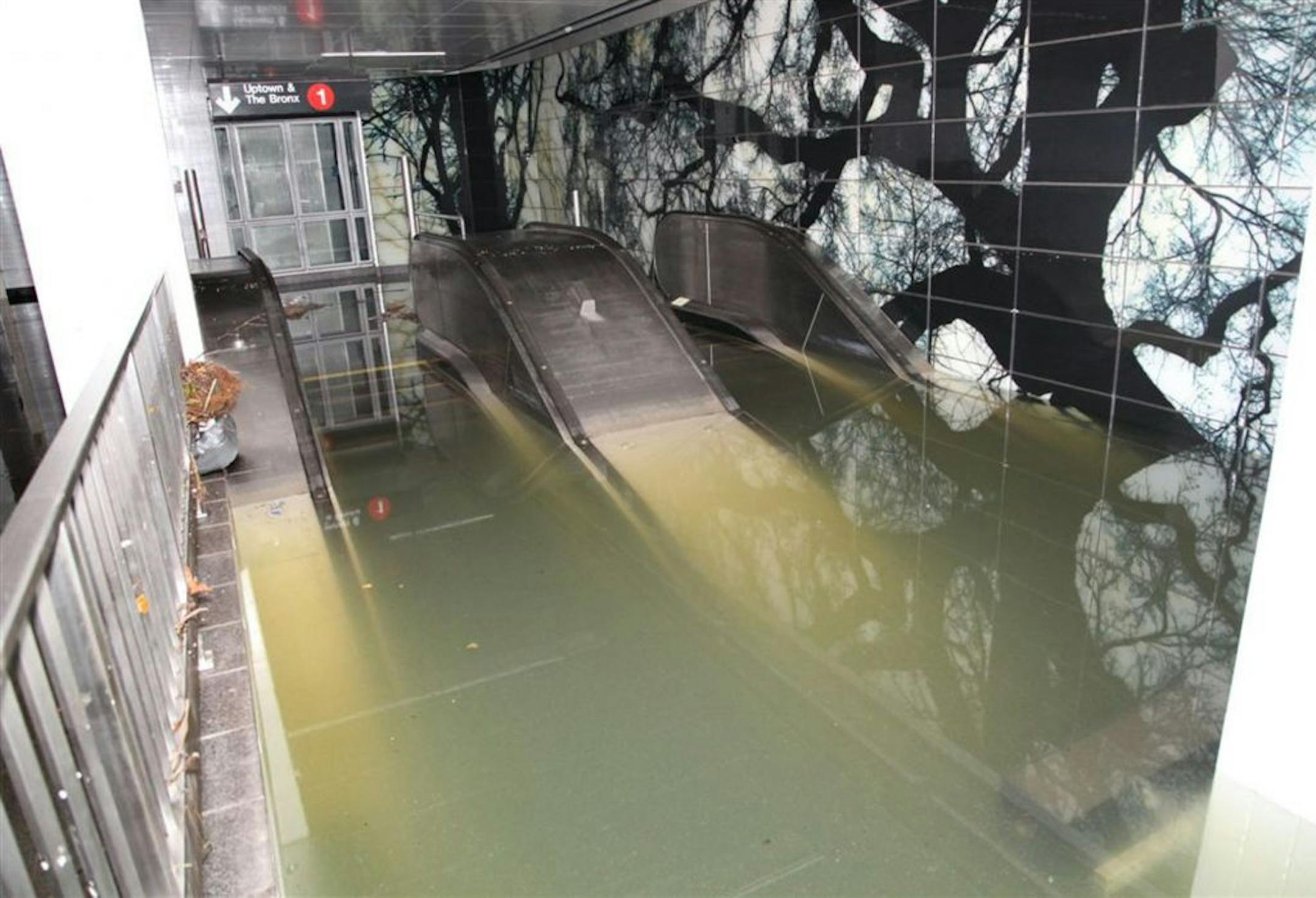 This Oct. 30, 2012, photo provided by New York's Metropolitan Transportation Authority (MTA) shows a flooded escalator in the South Ferry station of the No. 1 subway line, in lower Manhattan, after Superstorm Sandy passed through New York. Floodwaters that poured into New York's deepest subway tunnels may pose the biggest obstacle to the city's recovery from the worst natural disaster in the transit system's 108-year history but on Wednesday Gov. Andrew Cuomo announced limited subway service wil