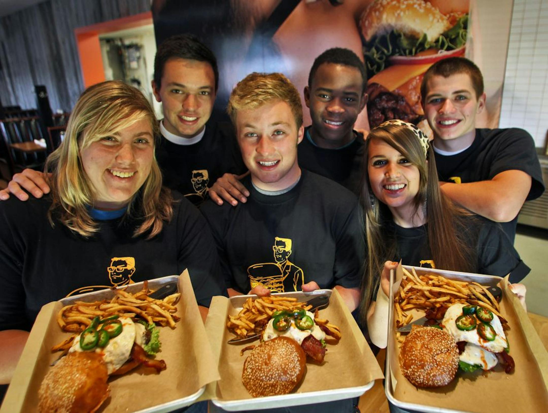 A group of students from DECA, a business club at Burnsville High School, designed a burger called the Blaze Burger to be sold at Burger Jones restaurant in Burnsville. It features peanut butter jalapenos, hot sauce, pepper jack cheese and an egg. Front row, l-r - Shelby Hamblin, Sam Dimmen, Taylor Smith. Back row l-r - Adam Saba, Mayowa Lekuti, Andrew Suel. (MARLIN LEVISON/STARTRIBUNE(mlevison@startribune.com