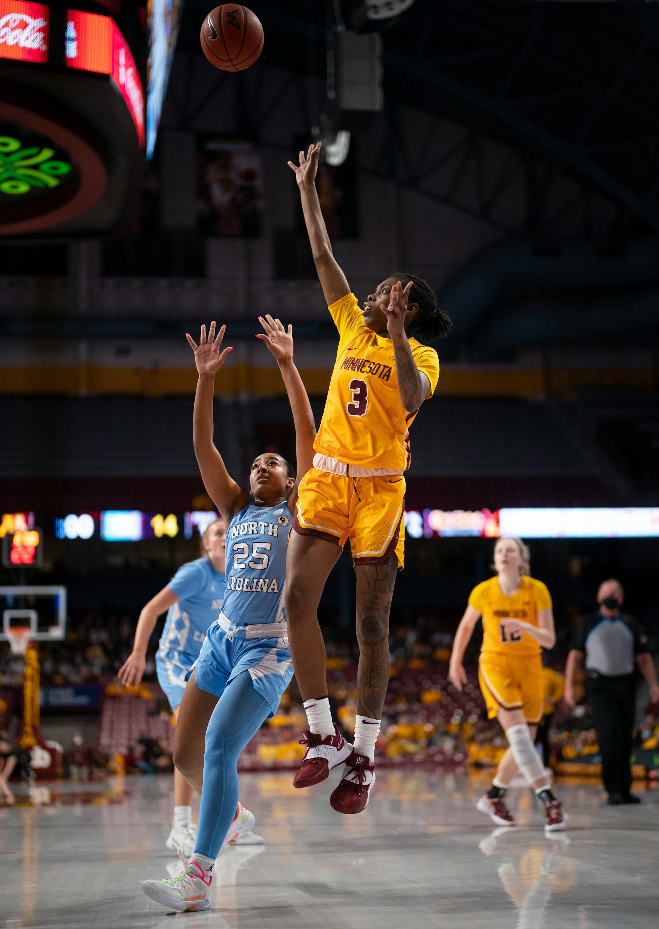 Minnesota Gophers guard Deja Winters (3) put up a first quarter shot as she was trailed by North Carolina Tar Heels guard Deja Kelly (25) Wednesday, Dec. 1, 2021 at Williams Arena in Minneapolis. The University of Minnesota women's basketball team faced the University of North Carolina in an NCAA basketball game Wednesday, Dec. 1, 2021 night at Williams Arena in Minneapolis. ] JEFF WHEELER • Jeff.Wheeler@startribune.com