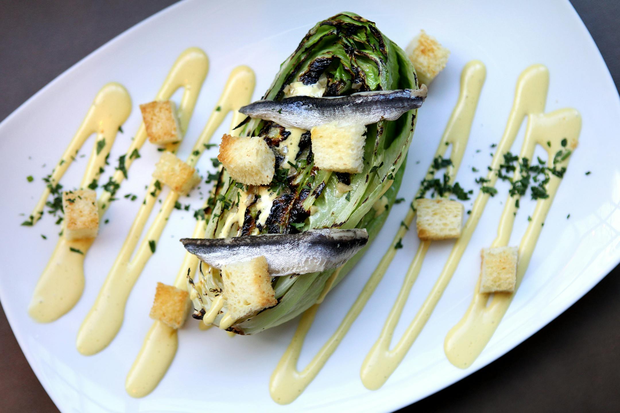 Grilled heart of romaine with egg yolk emulsion and dijon vinaigrette at The Kenwood restaurant in Minneapolis November 14, 2012. (Courtney Perry/Special to the Star Tribune)