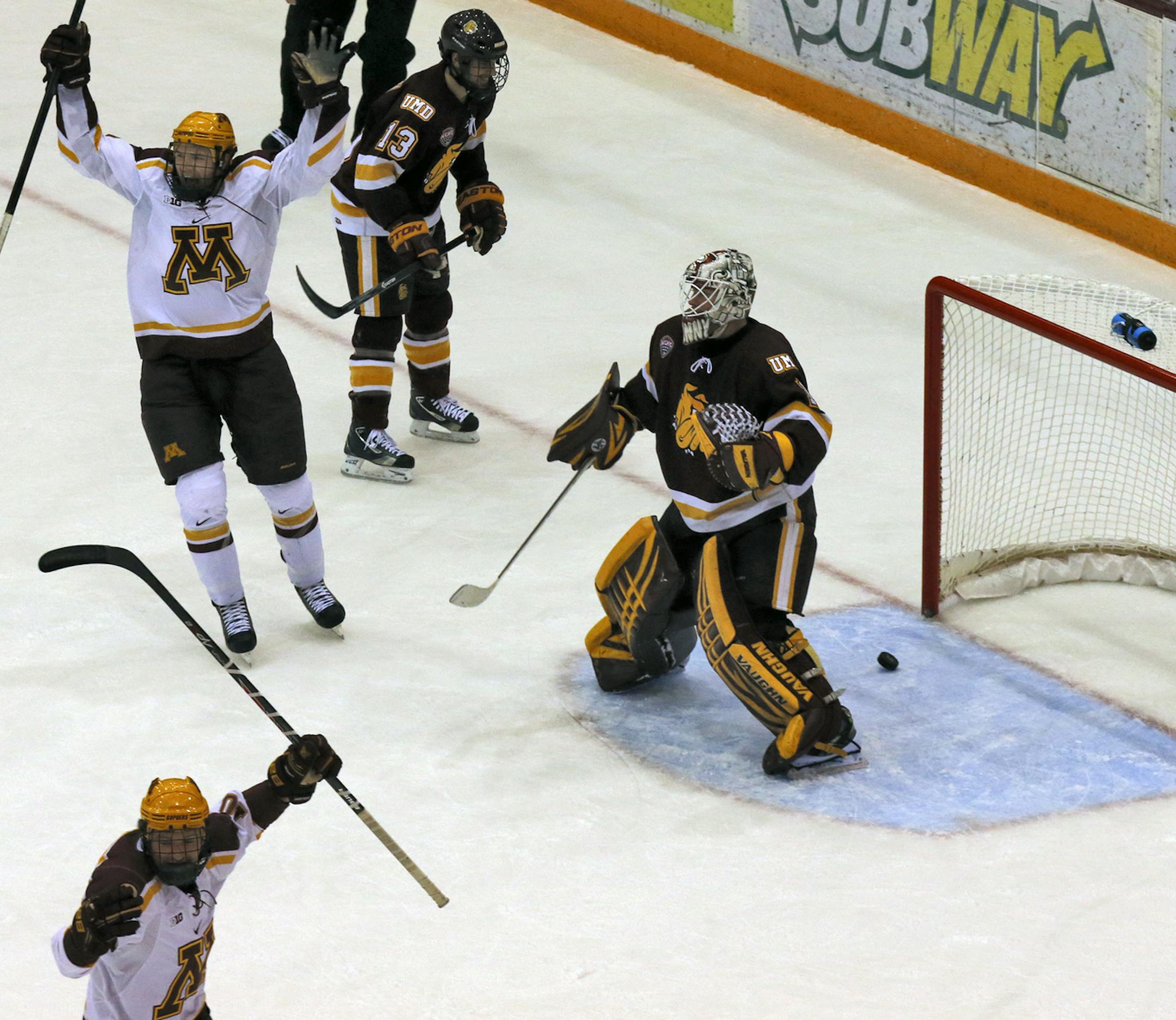 UM Gophers vs. UMD Bulldogs hockey. Gophers Tom Serratore, top, celebrated after scoring a first period goal beating Duluthe goalie Aaron Crandall on the shot. (MARLIN LEVISON/STARTRIBUNE(mlevison@startribune.com)