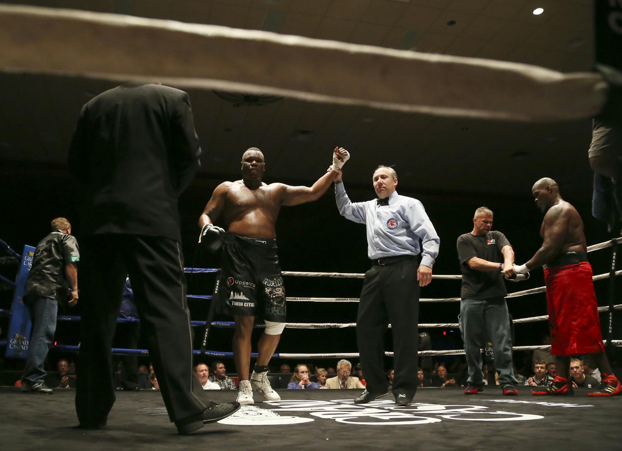 Aaron "Gorilla" Green delivered punishing body shots to his opponent Stacey Frazier before the fight was stopped by TKO in the fifth round during Grand Friday Night Fights at Grand Casino Hinckley Friday, Aug. 16, 2013.](DAVID JOLES/STARTRIBUNE) djoles@startribune.com Local boxer Aaron "Gorilla" Green stopped his opponent Stacey Frazier by TKO during the fifth round of a scheduled six round boxing match during Grand Friday Night Fights at Grand Casino Hinckley Friday, Aug. 16, 2013.** Aaron "Gor