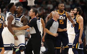Officials intervened as Minnesota Timberwolves forward Jimmy Butler (23) exchanged words with Utah Jazz guard Ricky Rubio (3) in the second half. ] AN