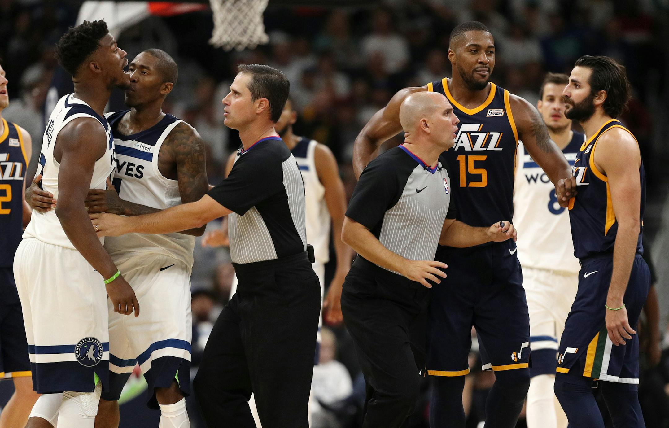 Officials intervened as Minnesota Timberwolves forward Jimmy Butler (23) exchanged words with Utah Jazz guard Ricky Rubio (3) in the second half. ] ANTHONY SOUFFLE ï anthony.souffle@startribune.com Game action from an NBA game between the Minnesota Timberwolves and the Utah Jazz Friday, Oct. 20, 2017 at the Target Center in Minneapolis.