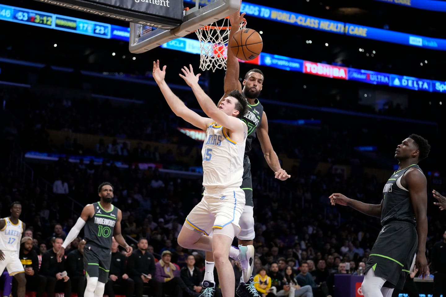 Timberwolves center Rudy Gobert blocks a shot from Lakers guard Austin Reaves during the first half Friday