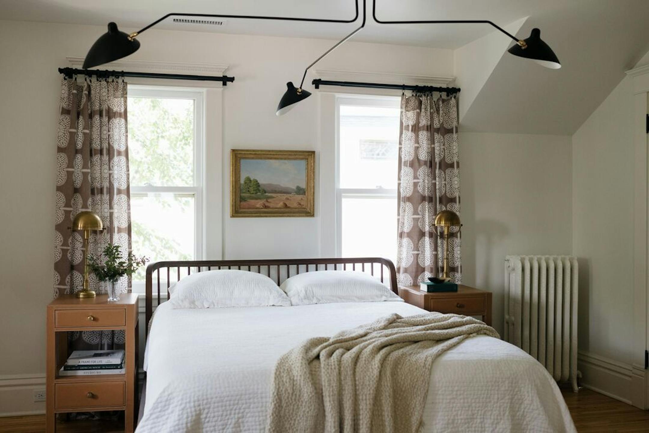 The new master bedroom combines traditional and modern elements.