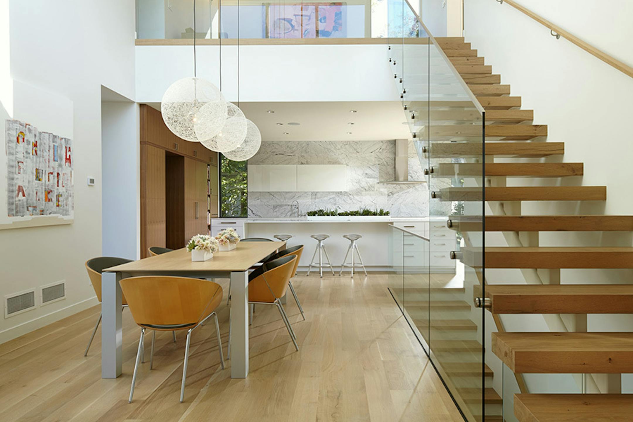 Sheridan Residence. A new modern home in an established urban neighborhood honors the scale of existing homes, by Peterssen/Keller Architecture.
