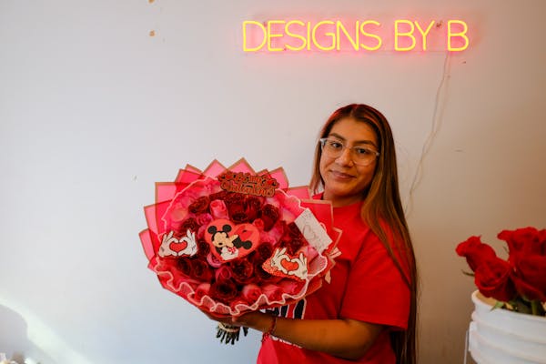 Brittany Vega has a small business making ramos buchones, elaborate bouquets that have become a viral Valentine's Day trend.