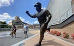 With a fanless home opener for the Twins on Tuesday, downtown restaurants and bars are worried about business. Pictured is Kirby Puckett's statue outs
