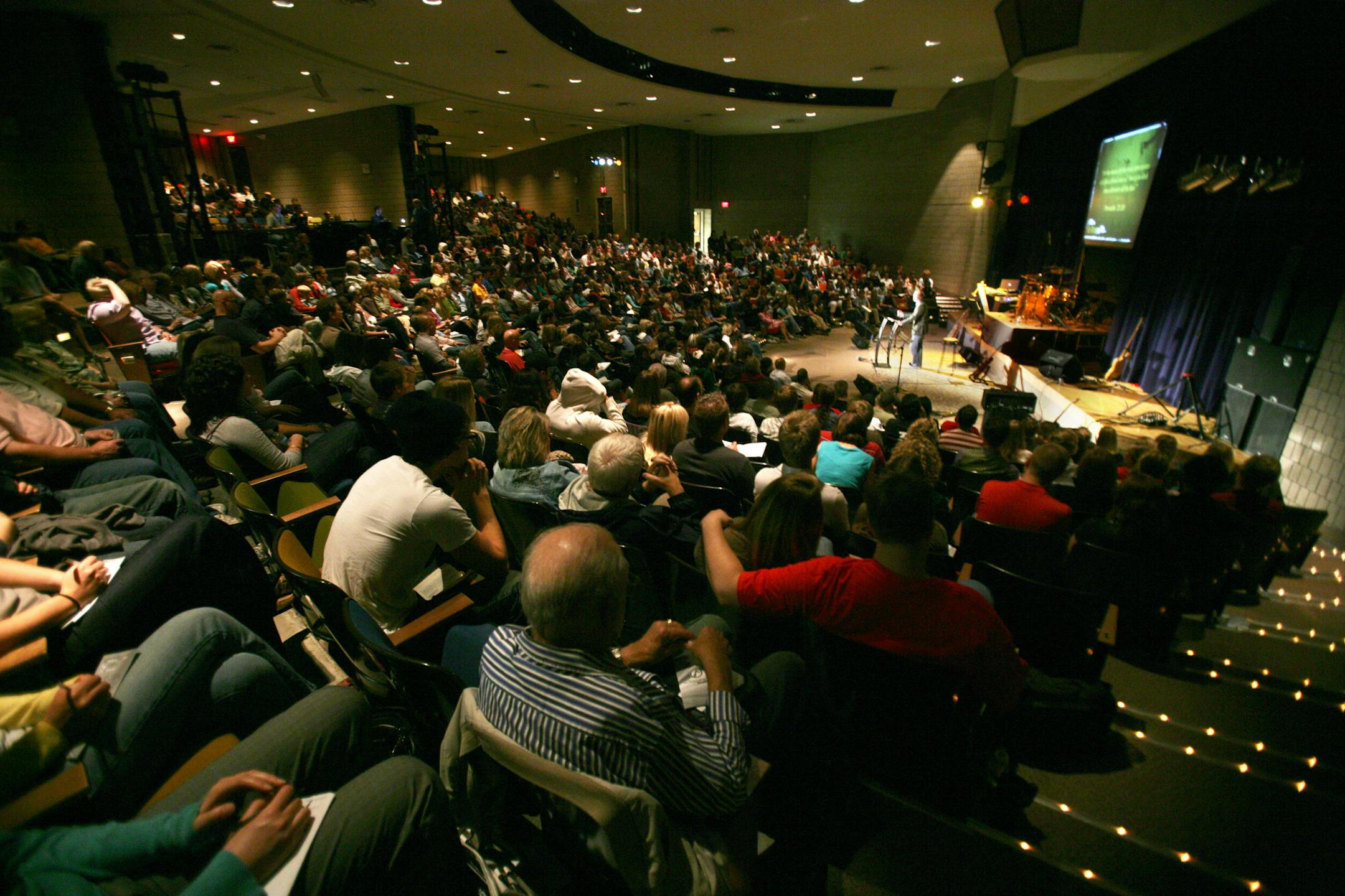 Pastor Peter Haas gives his sermon at Substace Church in the auditorium of Fridley High School. About 650 people watched his sermon about de-stessing you life.