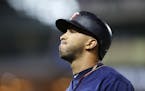 Minnesota Twins left fielder Eddie Rosario (20) walked back to the dugout after his fly ball was caught for an out in the eighth inning.