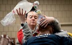 Kennedy Carlson practices keeping a supply of oxygen going as part of a fast-tracked paramedics course held at Anoka Technical College on Wednesday.