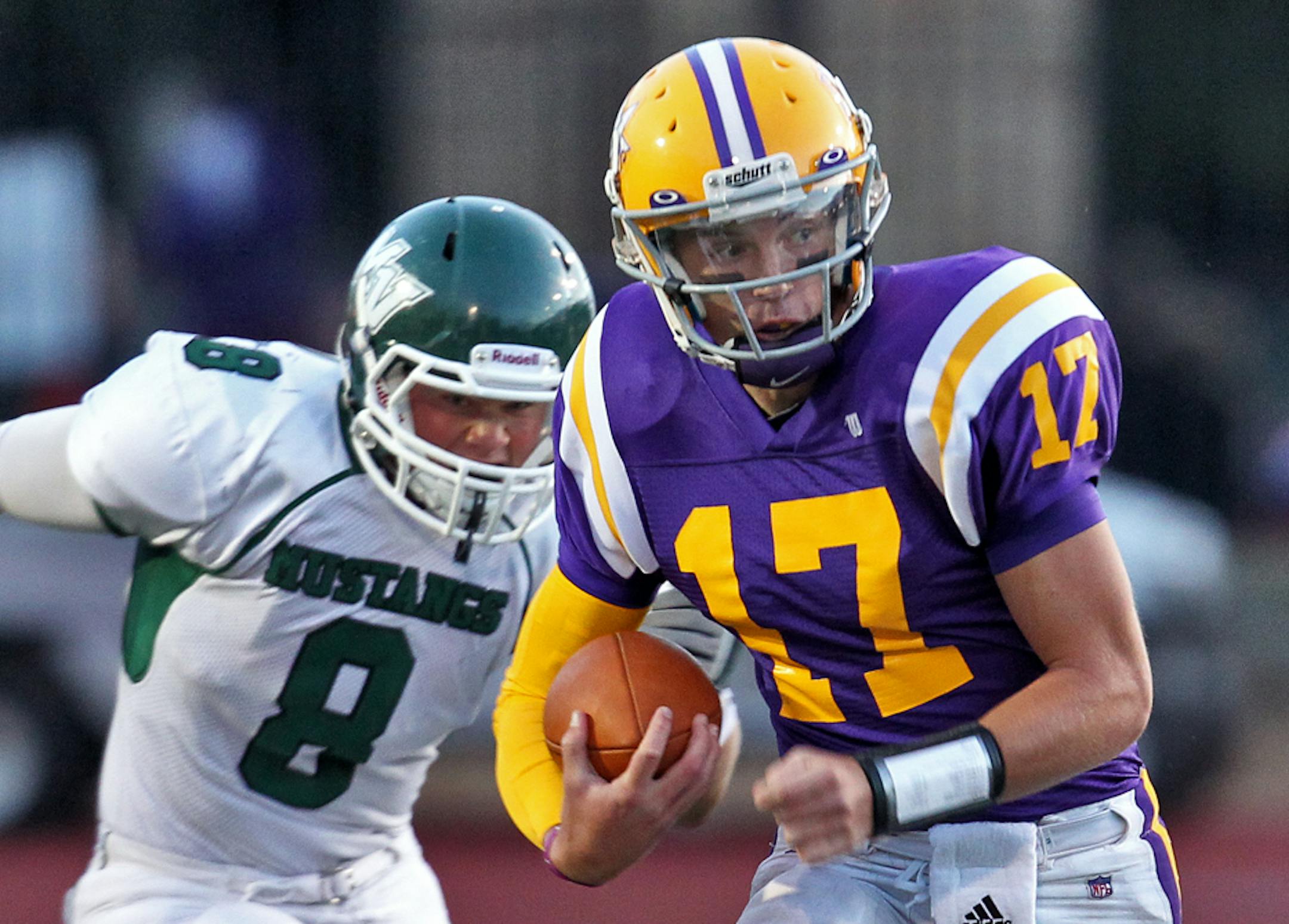 Prep football - Mounds View (MV) vs. Cretin-Derham Hall (CDH). CDH quarterback Conor Rhoda (17) avoided Mounds View tacklers including Lars Anderson (8). (MARLIN LEVISON/STARTRIBUNE(mlevison@startribune.com (cq program)