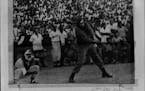 February 26, 1962: Fidel Makes a Hit -- After 12 days out of the public eye, Cuban Prime Minister Fidel Castro appeared Sunday between games of a doub
